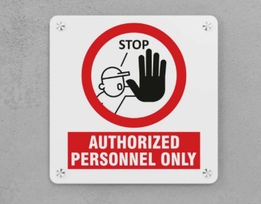 image of person holding a sign saying authorized personnel only